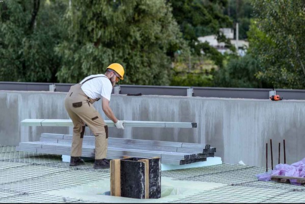 Professional commercial roofing contractor working on a flat roof