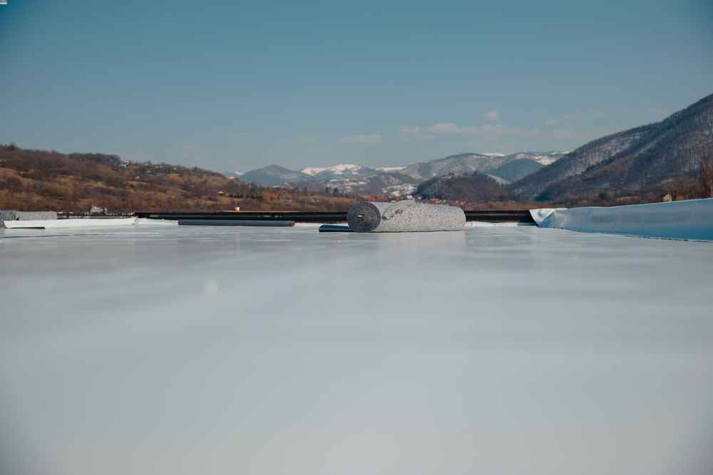 Low-slope commercial roofing system with durable materials installed on a flat-roof building